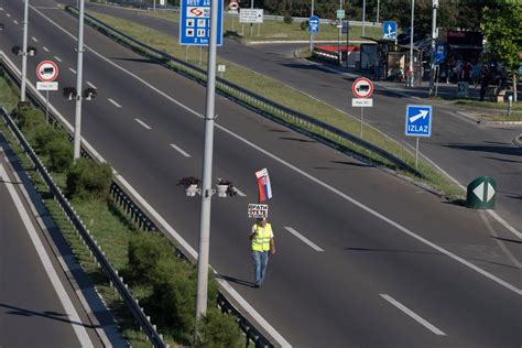 Opponents of Serbia’s populist leader block main highway to keep up pressure after weeks of protests